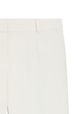 Pantalones regular fit con bajos acampanados, Blanco