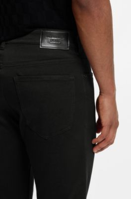 Porsche x BOSS tapered-fit pants in stretch denim, Black