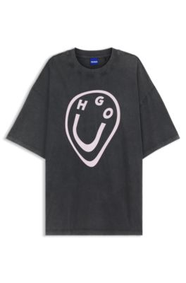 Camiseta de punto de algod&oacute;n con estampado de logo Happy HUGO con efecto fundido, Negro