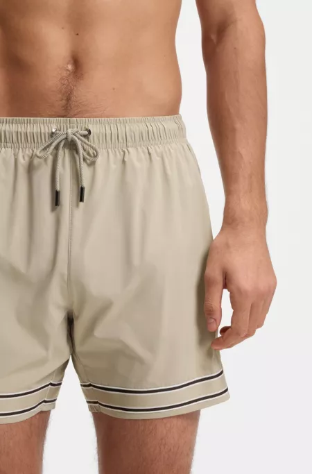 Drawstring swim shorts in stretch fabric with tape trim