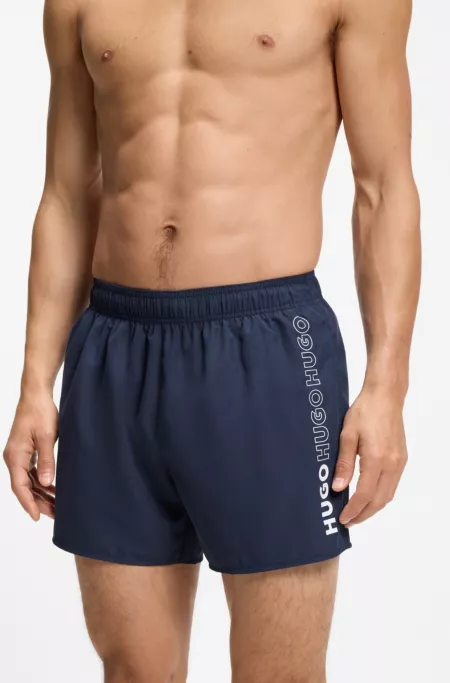 Swim shorts with repeated logos