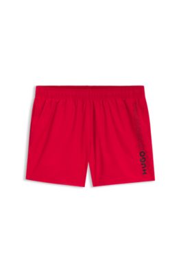 Swim shorts with repeated logos, light pink