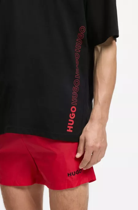 Oversized-fit cotton T-shirt with all-over logo print