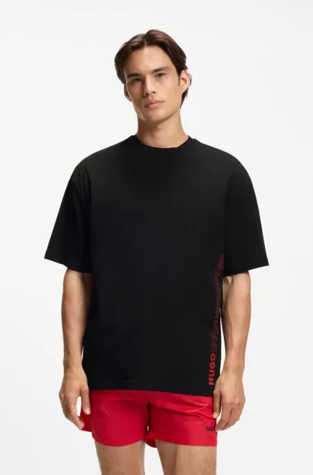Oversized-fit cotton T-shirt with all-over logo print