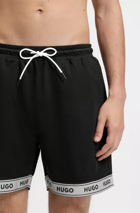 Mesh swim shorts with jacquard logo tape