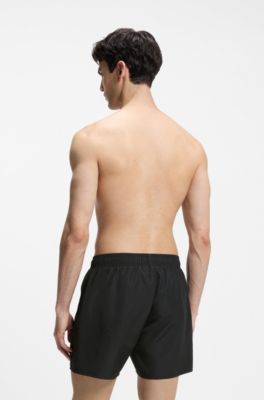 Ba&ntilde;ador tipo shorts con logos apilados por toda la prenda, Negro