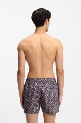 Quick-dry swim shorts with all-over print, light pink