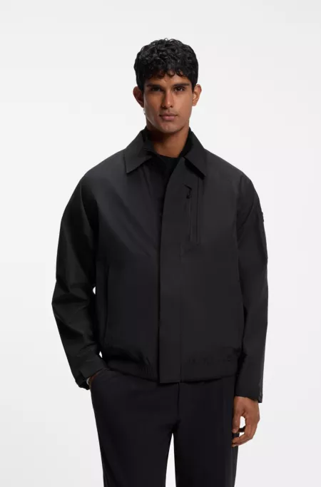 Water-repellent blouson jacket with welded front placket