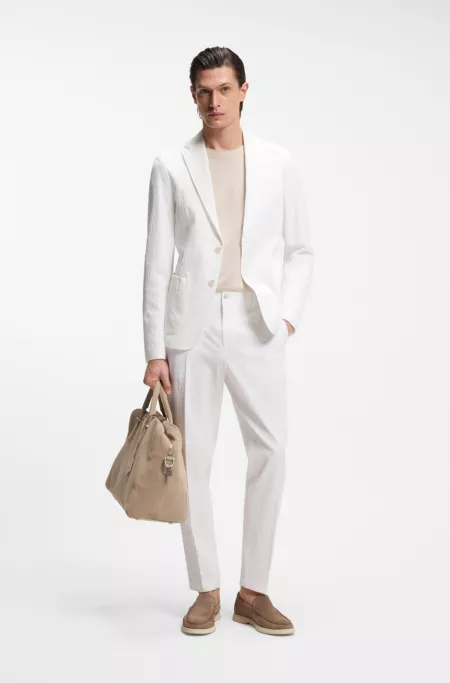 Tapered-fit trousers in stretch-cotton seersucker