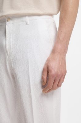 Tapered-fit trousers in stretch-cotton seersucker, White