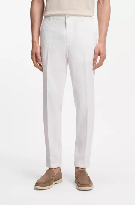 Tapered-fit trousers in stretch-cotton seersucker