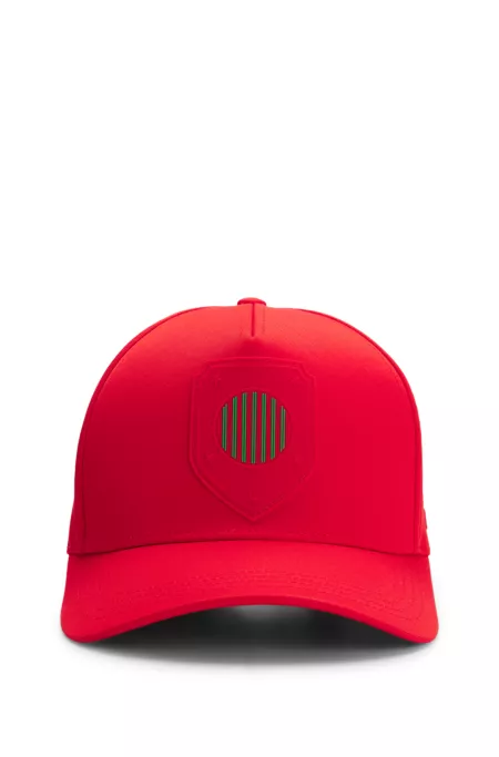 Logo cap in lustrous twill with country-flag badge