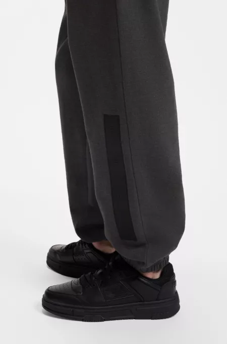 Relaxed-fit sweatpants in cotton with logo trim