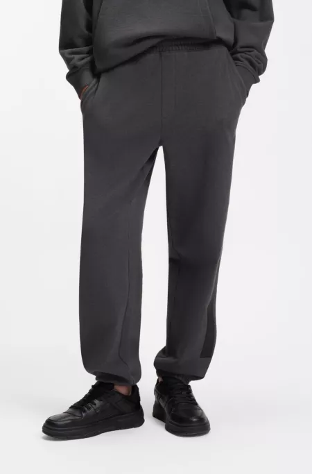 Relaxed-fit sweatpants in cotton with logo trim