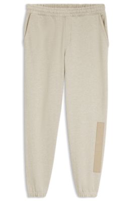 Pantalones de ch&aacute;ndal relaxed fit de algod&oacute;n con detalle de logo, Beige claro