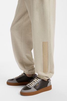 Relaxed-fit sweatpants in cotton with logo trim, Light Beige