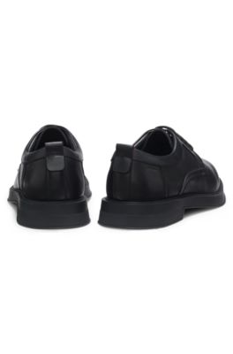 Derby shoes in leather with perforated monograms, Black