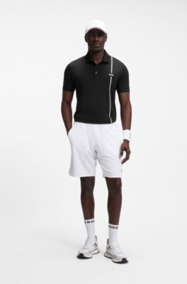 Active polo de secado r&aacute;pido con la raya caracter&iacute;stica de la firma, Negro