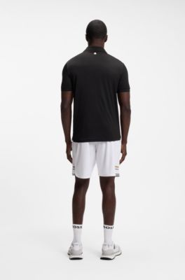 Active polo de secado r&aacute;pido con la raya caracter&iacute;stica de la firma, Negro