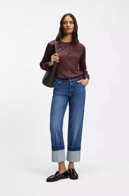 Leather bucket bag with metallic logo lettering