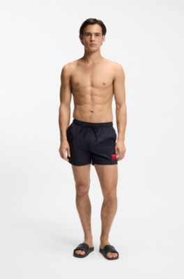 Mules confectionn&eacute;es en Italie avec logo ton sur ton, Noir