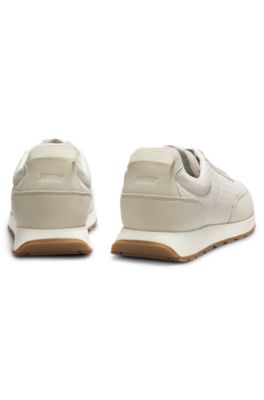 Running-inspired trainers with monogram-jacquard uppers, Light Beige