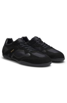 Mixed-material trainers with open mesh, Black