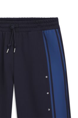 Pantalones de ch&aacute;ndal relaxed fit de algod&oacute;n con raya lateral, Azul oscuro
