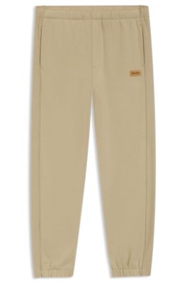 Cotton-terry sweatpants with logo badge, Beige