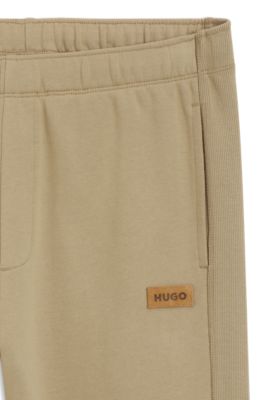 Cotton-terry sweatpants with logo badge, Beige