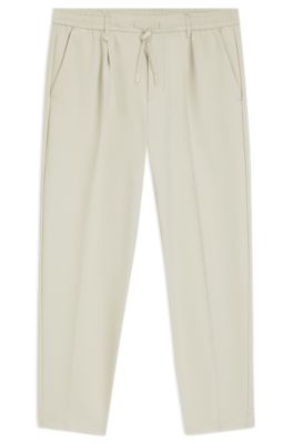 Pantalones tapered fit activos de tejido el&aacute;stico repelente al agua, Beige claro