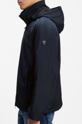 Chaqueta regular fit con capucha y acabado repelente al agua, Azul oscuro