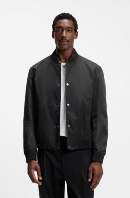 Water-repellent jacket with monogram-patterned sleeves, Black