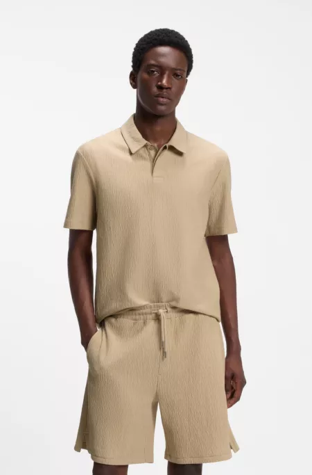 Cotton-blend polo shirt with creased effect