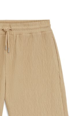 Shorts de algod&oacute;n el&aacute;stico con efecto arrugado, Beige