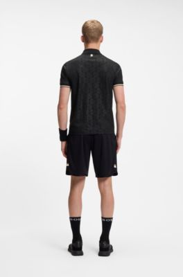 Active Polo Slim &agrave; motif de balles de tennis en relief, Noir