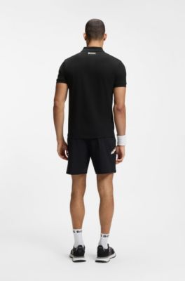 Polo en piqu&eacute; de coton &agrave; motif tennis, Noir