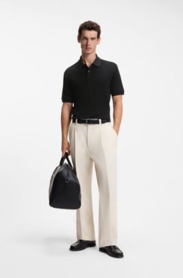 Polo regular fit de algod&oacute;n con cuello estampado, Negro