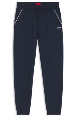 Pantalones de ch&aacute;ndal de algod&oacute;n con pu&ntilde;os el&aacute;sticos y ribetes con logo, Azul oscuro