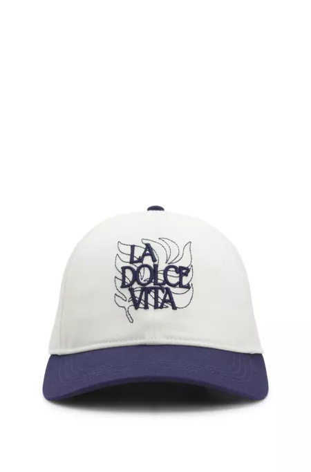 Woven cap with adjustable strap