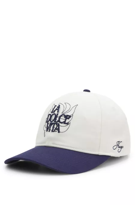 Woven cap with adjustable strap