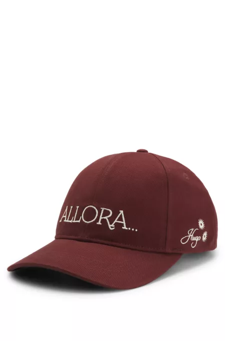 Woven cap with adjustable strap
