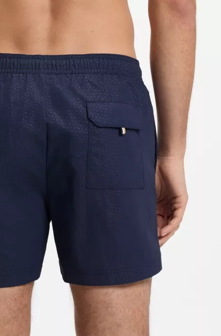Swim shorts with all-over monogram print