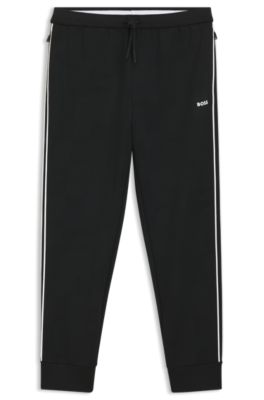 Triangle-jacquard track pants with rubberized logo, Black
