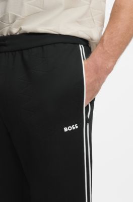 Triangle-jacquard track pants with rubberized logo, Black