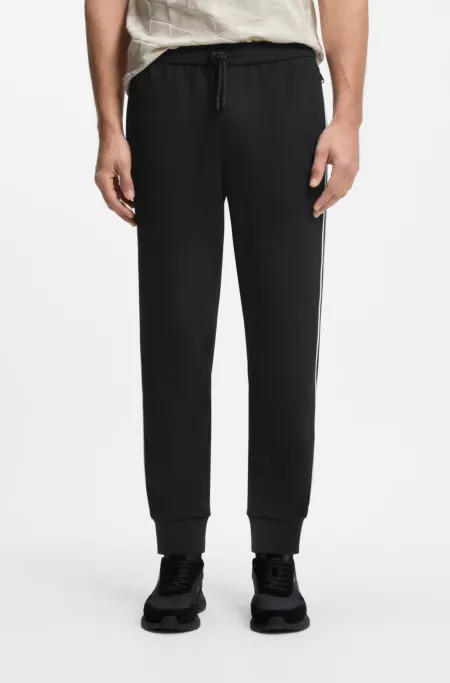 Triangle-jacquard track pants with rubberized logo