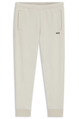Pantalones de ch&aacute;ndal de algod&oacute;n con logo bordado, Beige claro