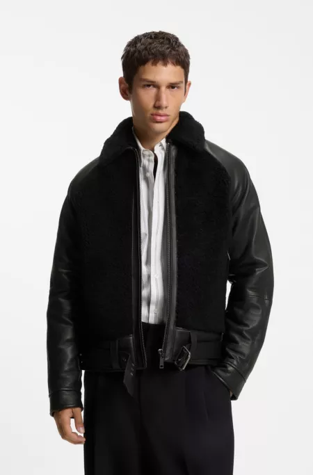 Belted leather jacket with shearling panels