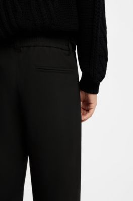 Pantalones straight-fit de tejido el&aacute;stico t&eacute;cnico, Negro