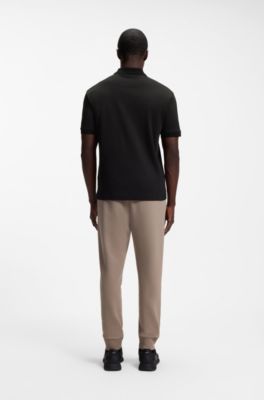 Polo de algod&oacute;n interlock con ribetes a rayas, Negro
